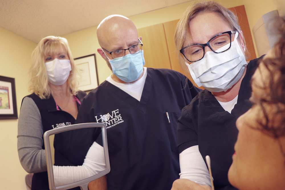 Dr. Hove and staff with patient