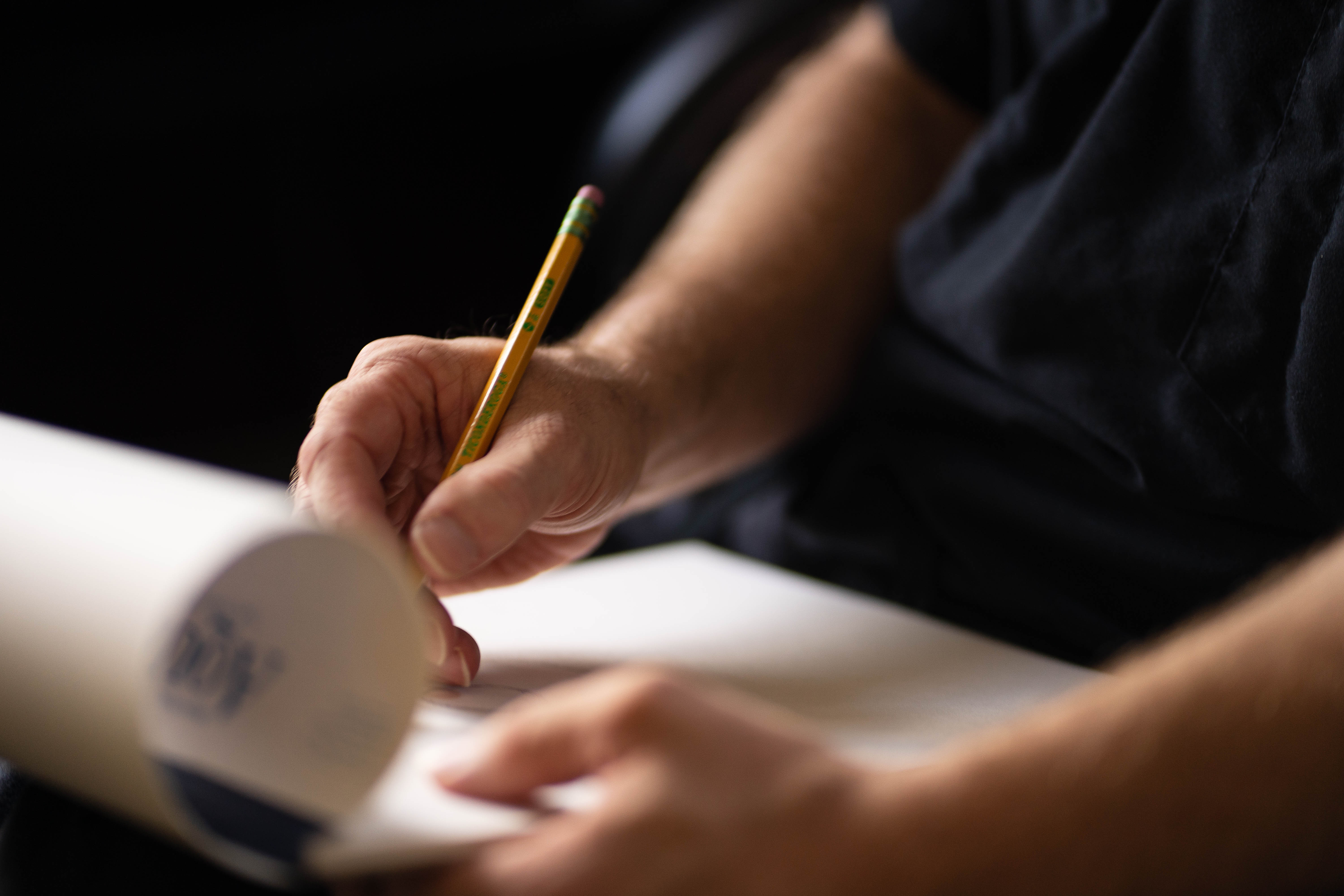 Dr. Hove drawing on a sketchbook