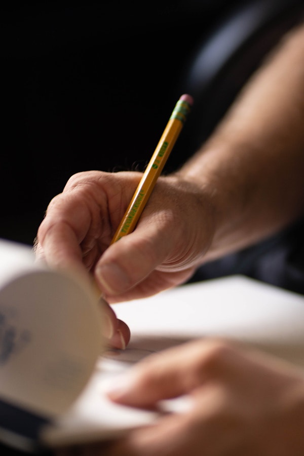 Dr. Hove drawing on a sketchbook