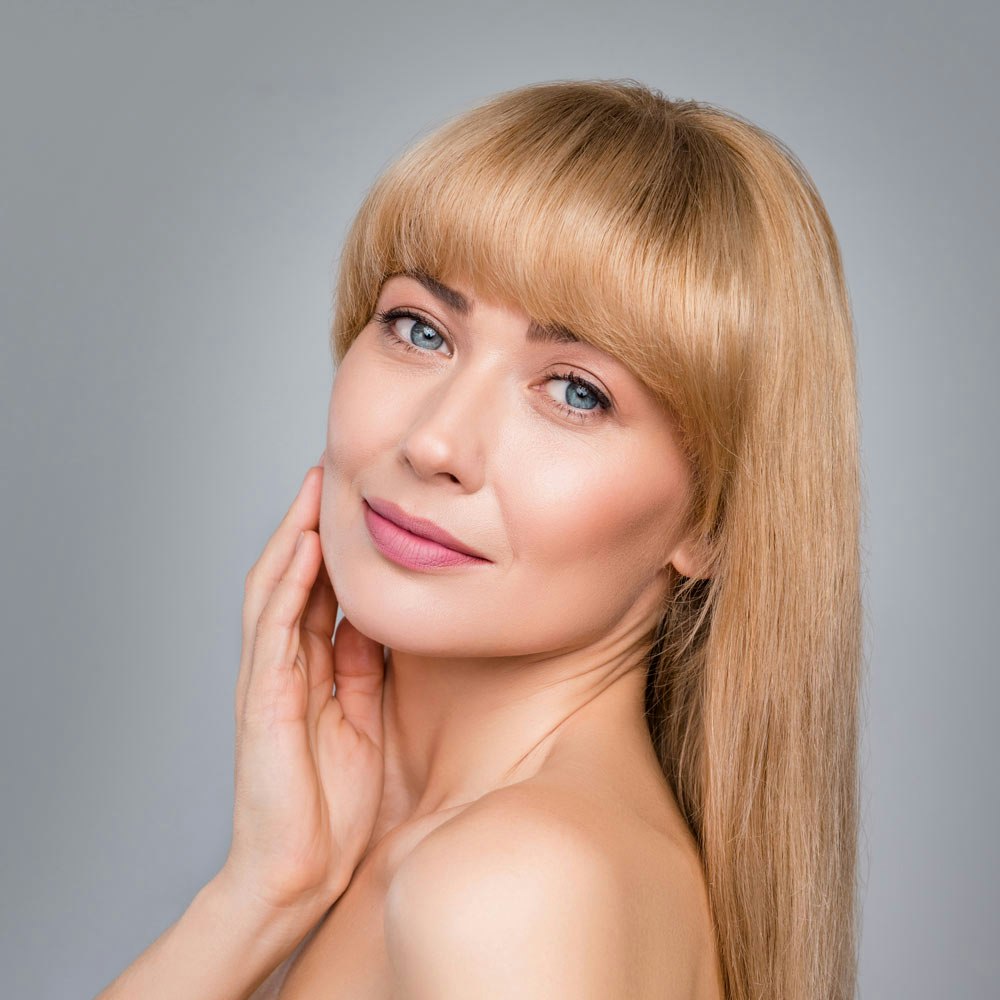 Woman with beautiful skin after microneedling treatment