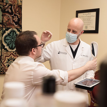Photo of Dr. Hove consulting patient