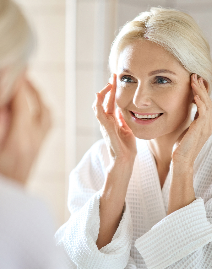 woman smiling in mirror