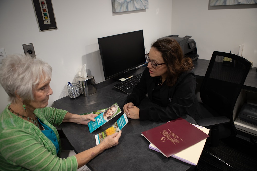 Staff member speaking with a patient