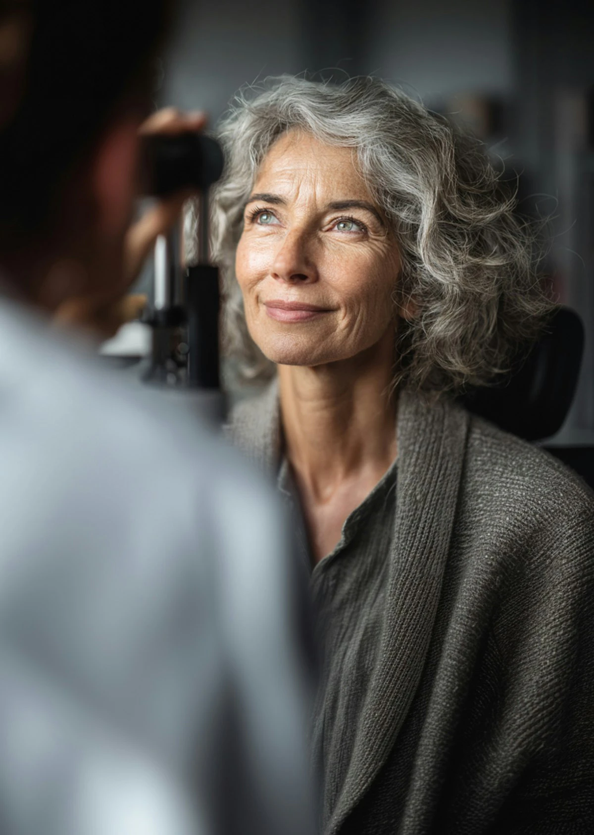 Senior woman smiling during an eye exam