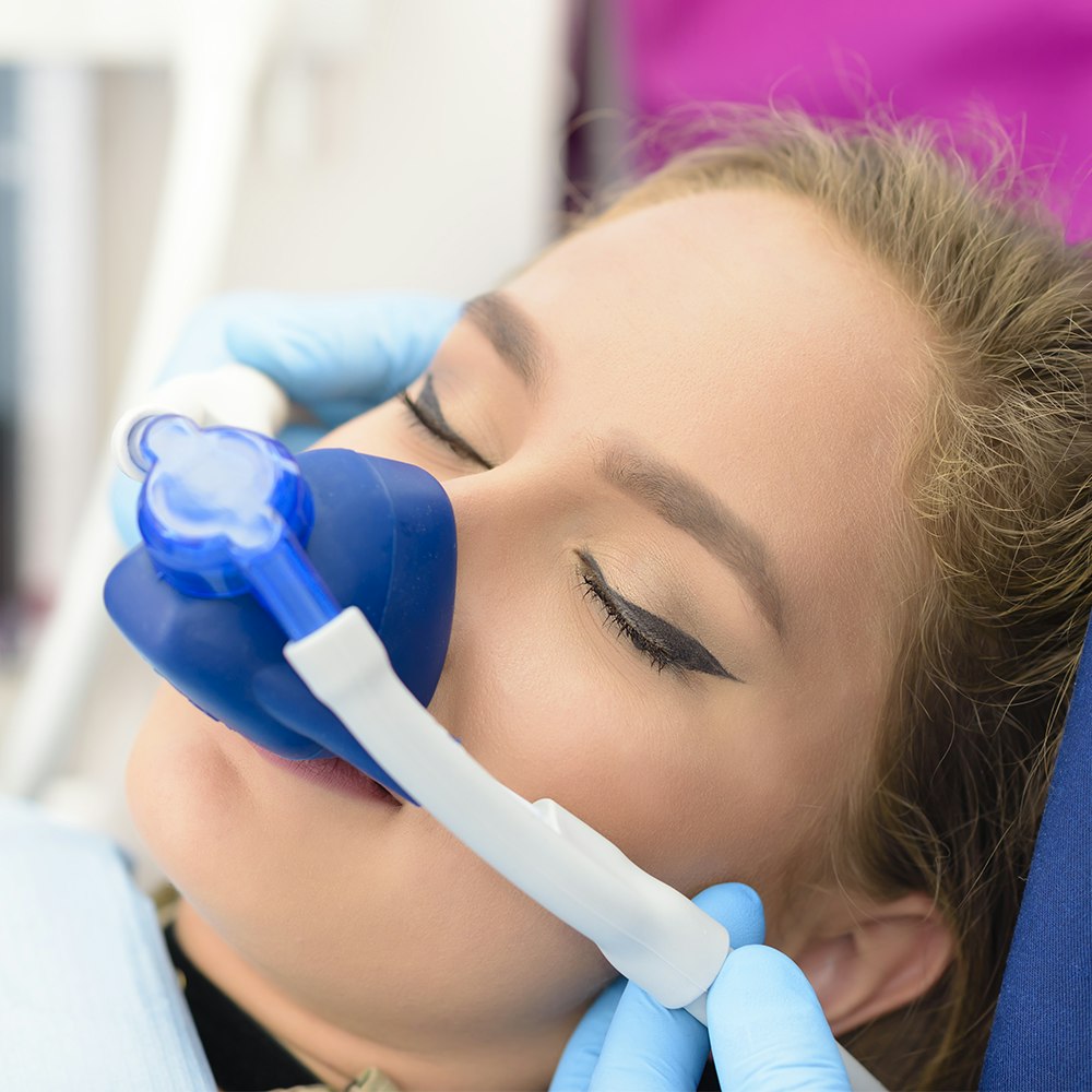 woman receiving nitrous oxide sedation