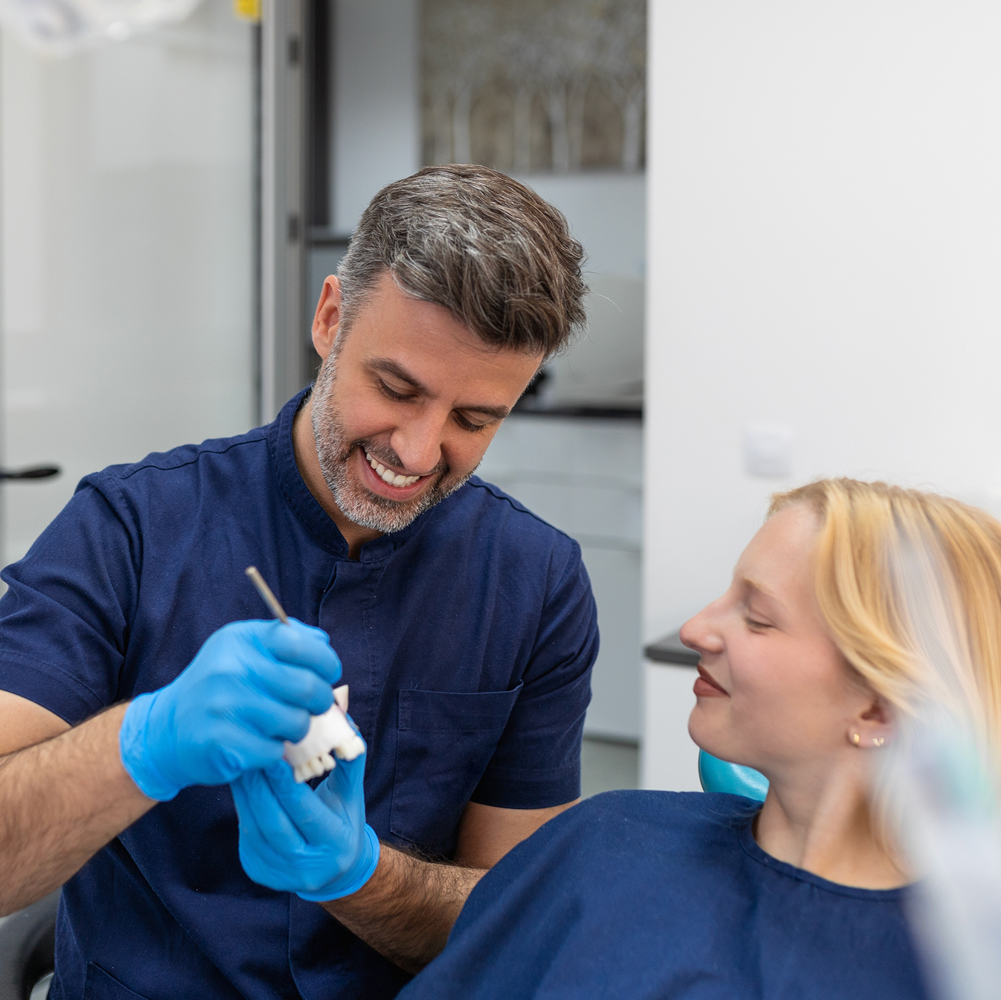 dentist and patient discussing candidacy
