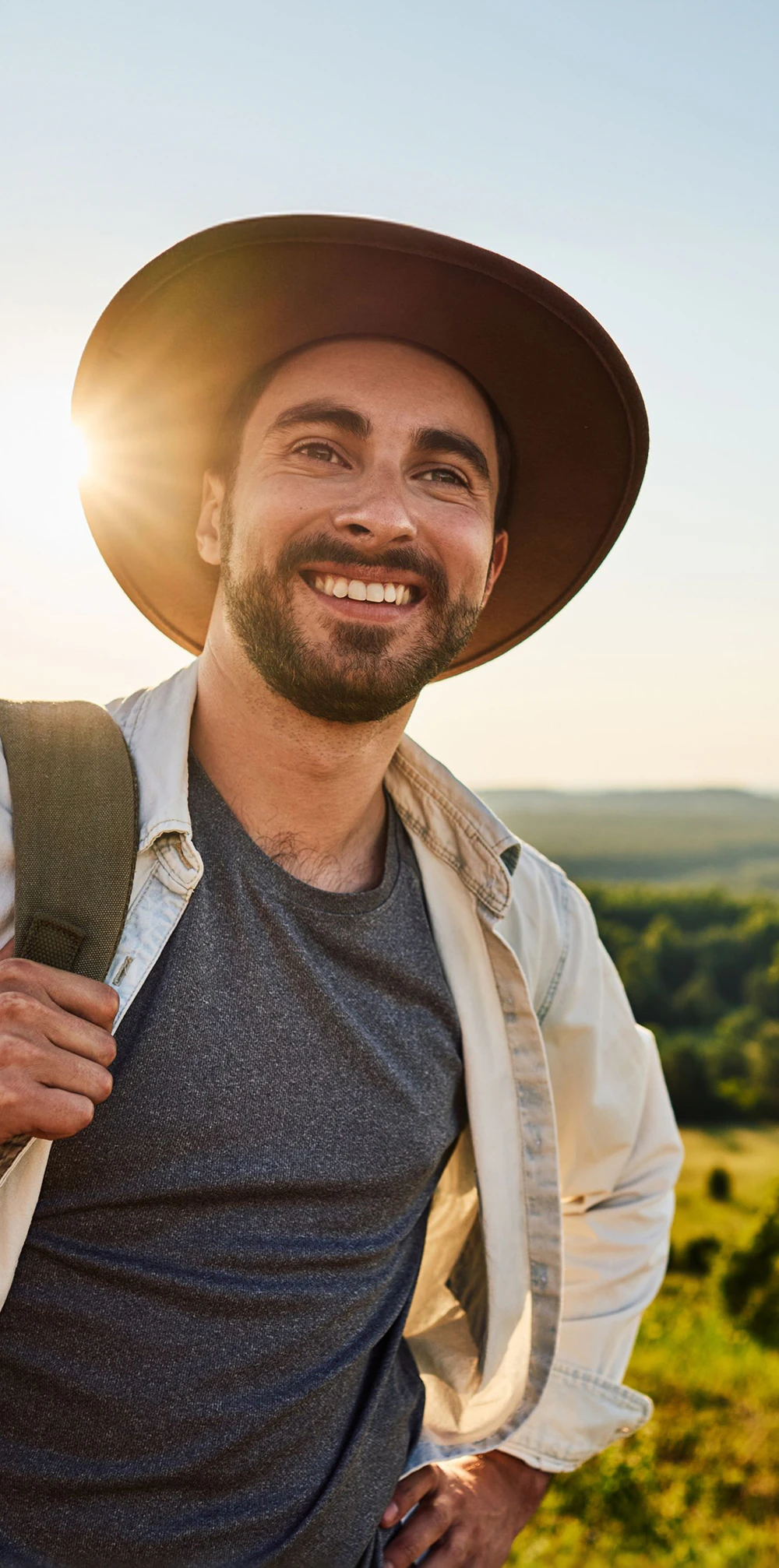man w/ hat smiling