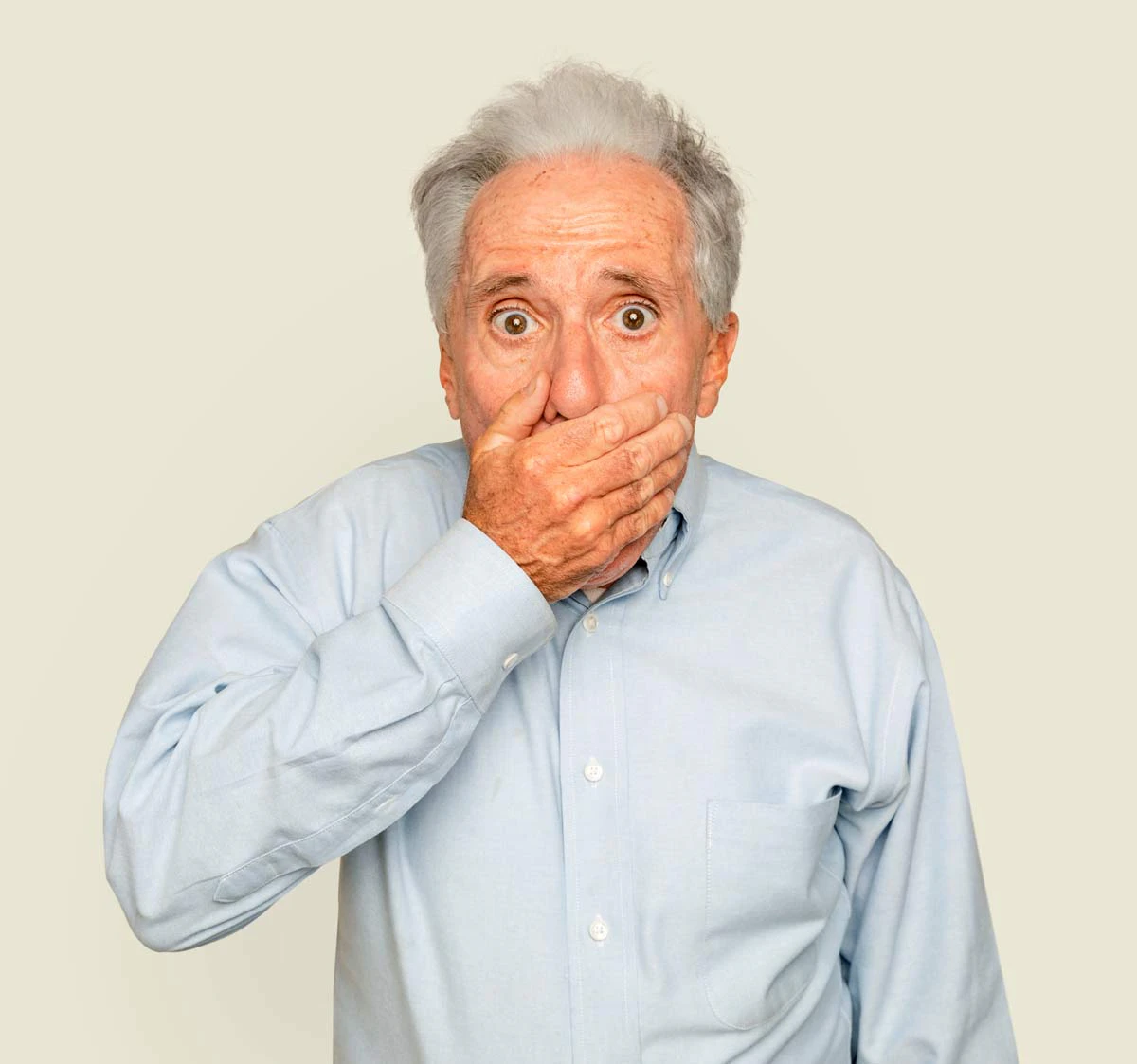 man with hand over his mouth