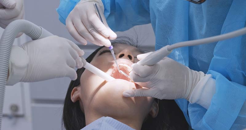 woman receiving scaling and root planing