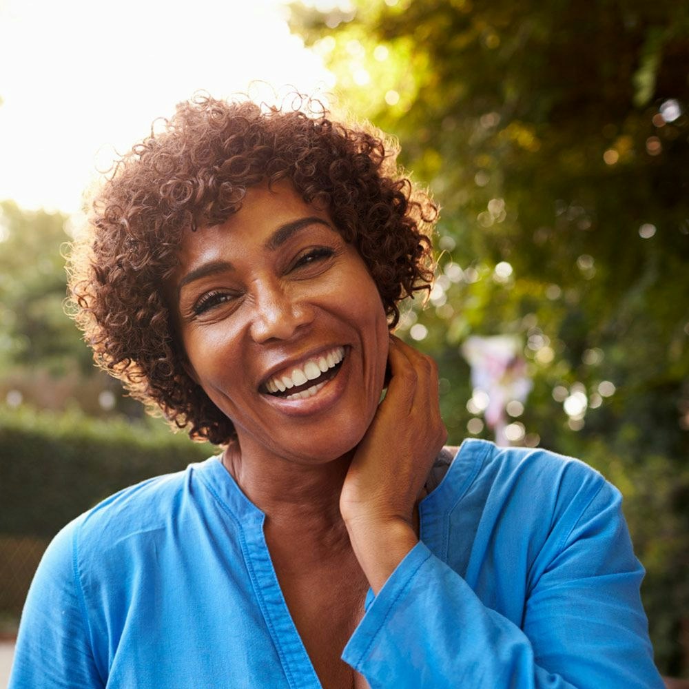 Smiling woman in blue blouse