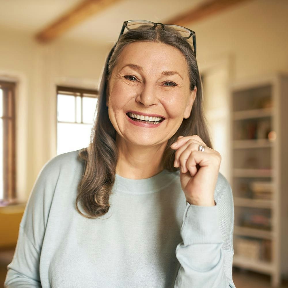 Older woman smiling indoors