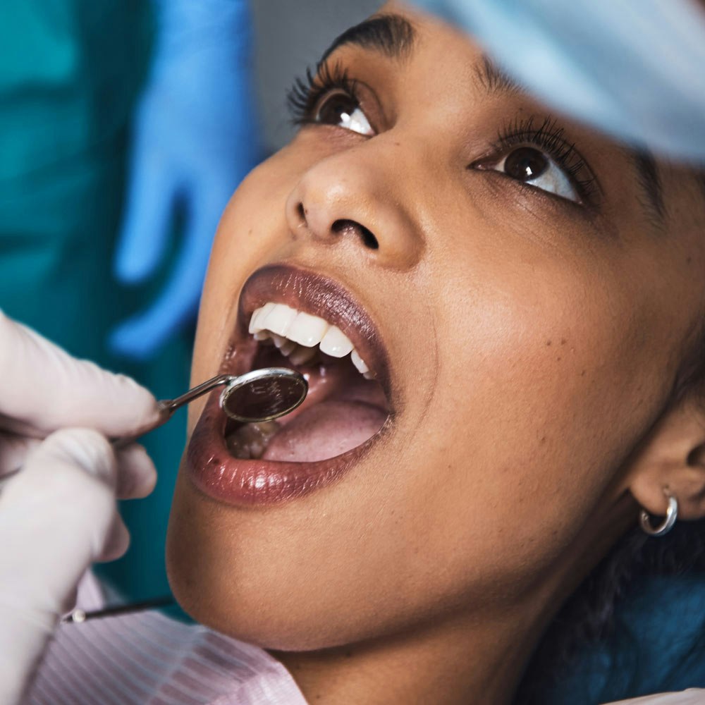 Woman getting teeth cleaned