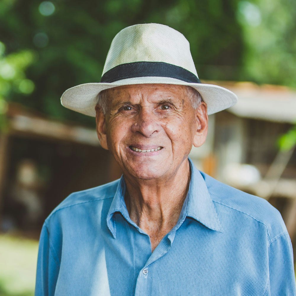 Older man smiling outdoors