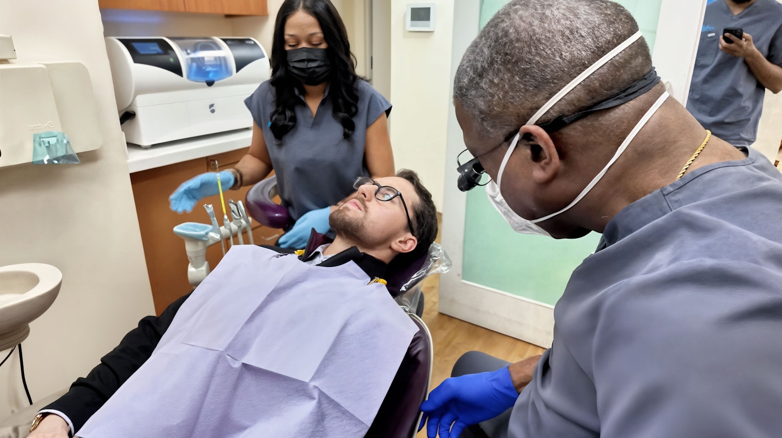 Team at Brooklyn Heights Dental w/ patient