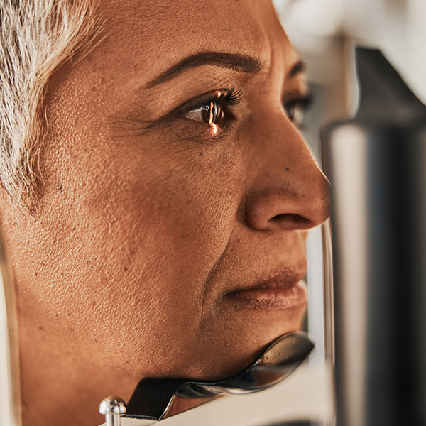 Woman with pterygium having eye examined