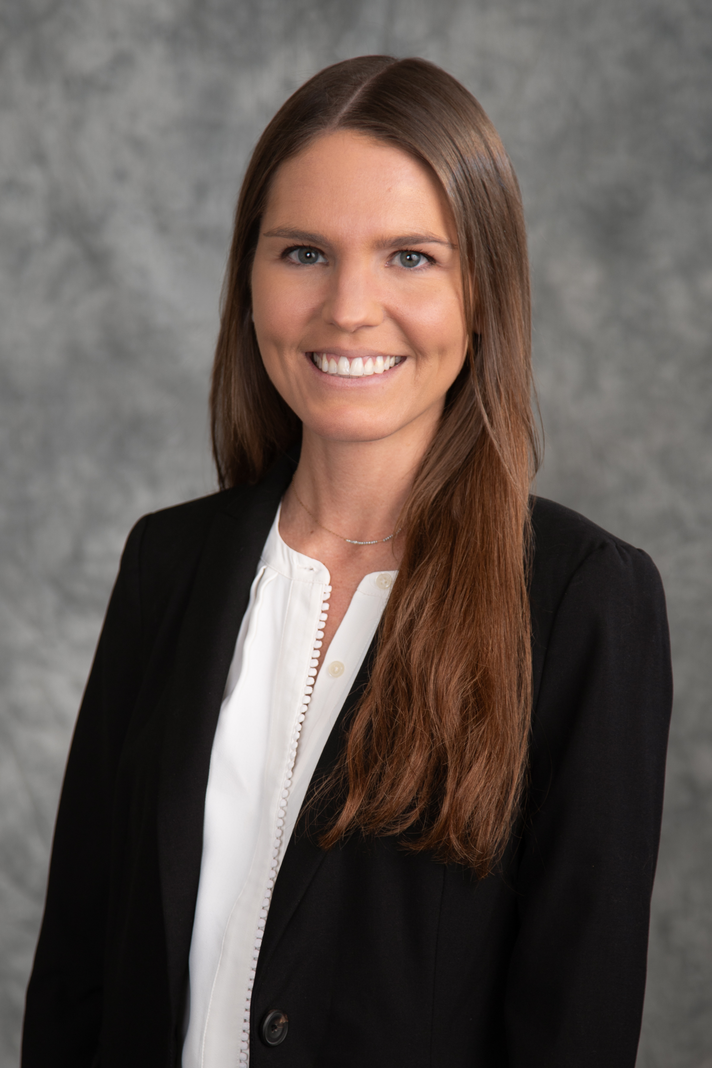 headshot of Dr. Jordan Comstock