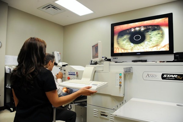 Doctors with patient observing eye