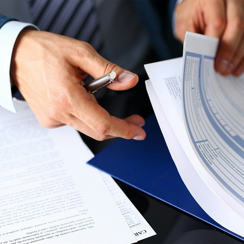 Lawyer reading insurance form