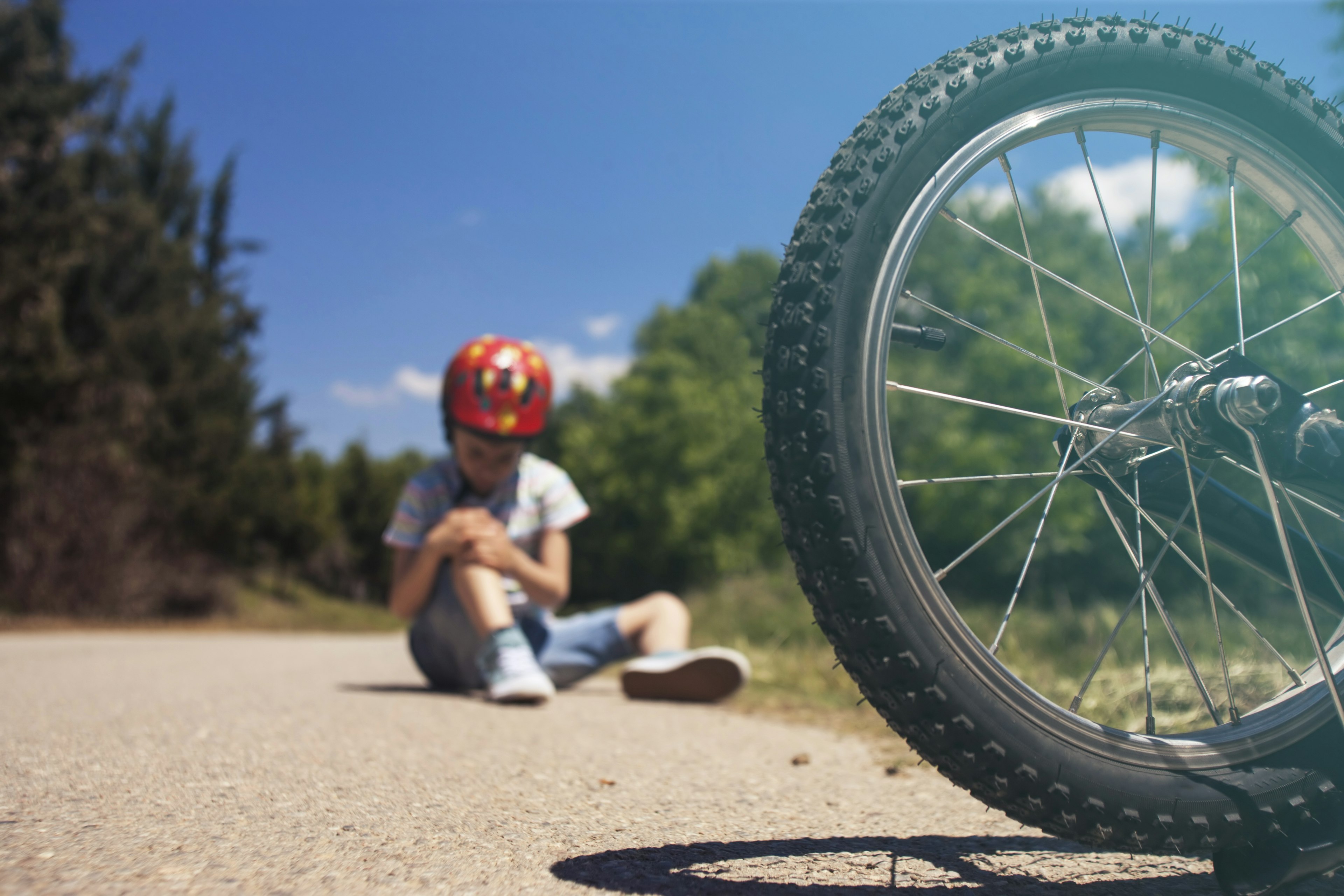 Fallen boy and bicycle