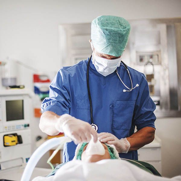 a doctor administering anesthesia