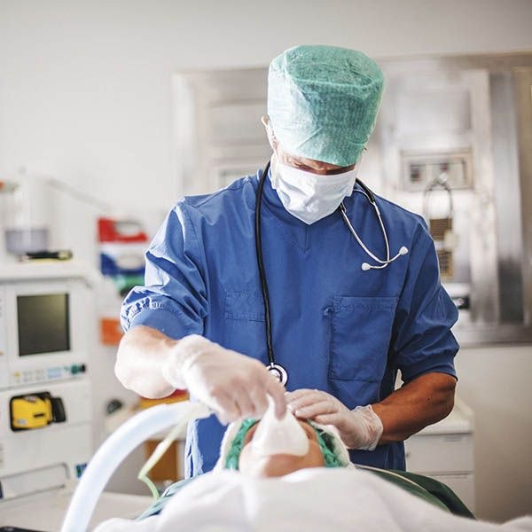 a doctor administering anesthesia