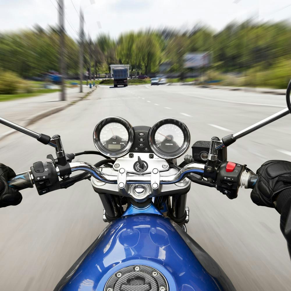 Point of view of a motorcyclist riding motorcycle fast