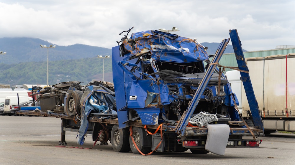 Smashed semi-truck on trailer