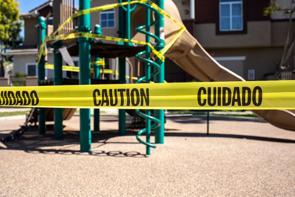 playground blocked off by caution tape