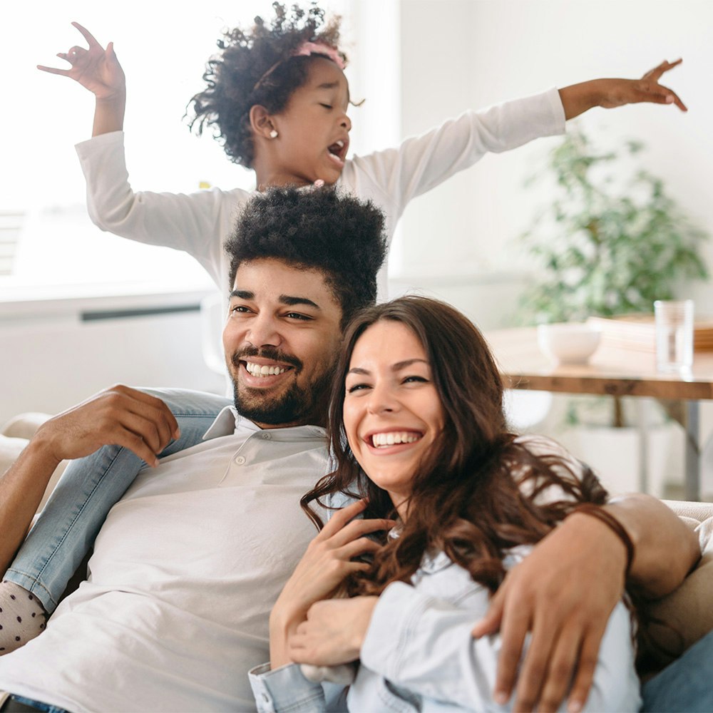 Happy couple with child after successful fertility treatment