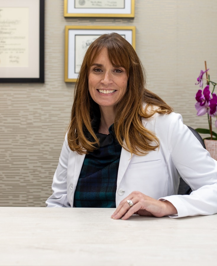 Dr Oakes wearing Doctor's Coat