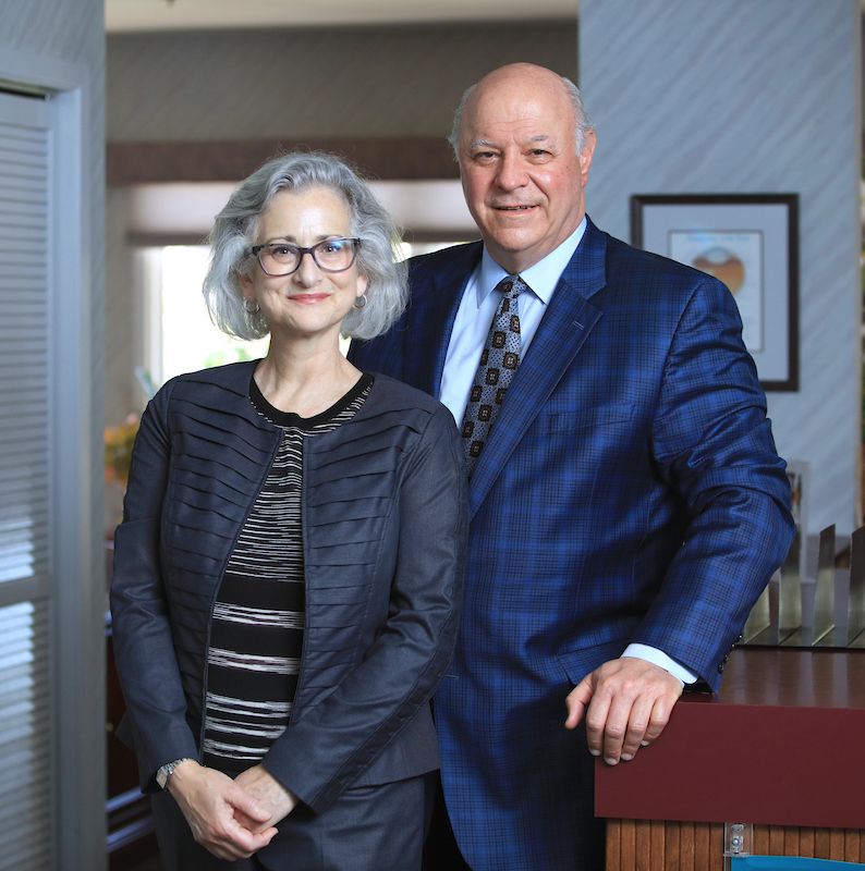 dr. del piero with woman in glasses