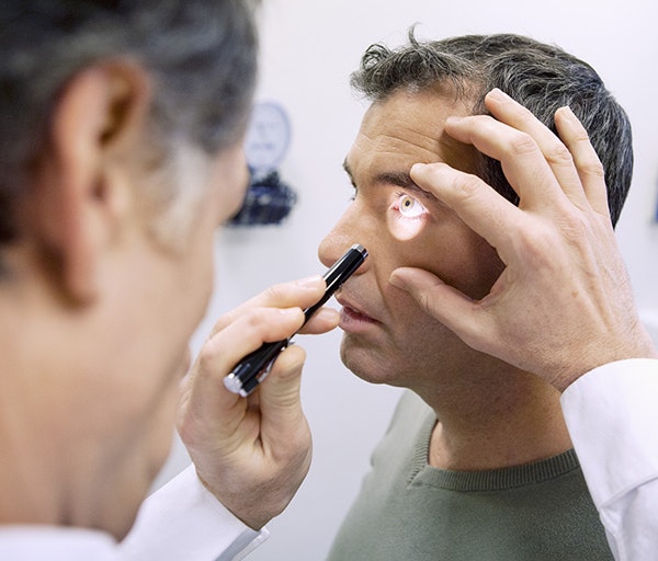 Ophthalmologist examining a patient's eye
