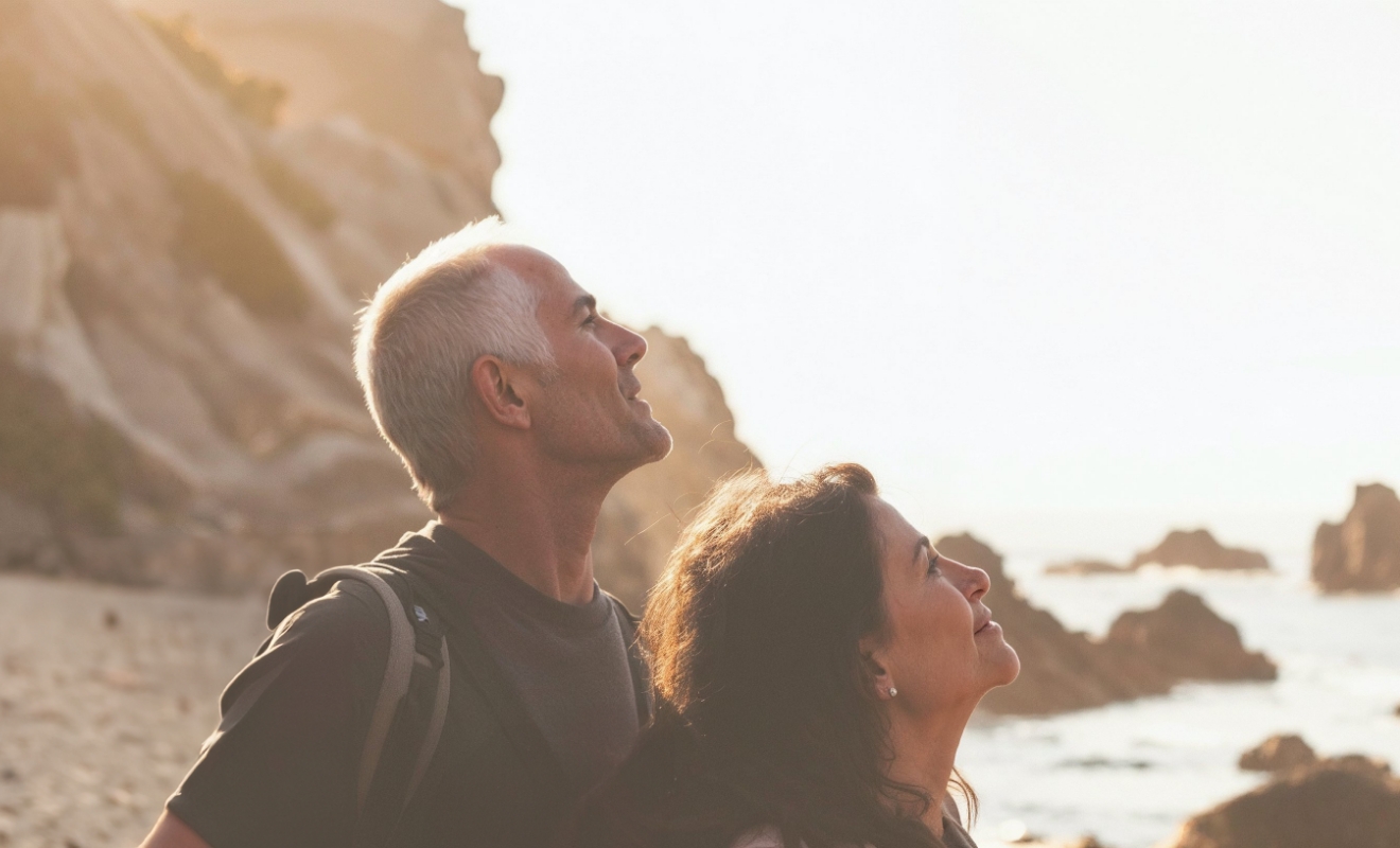 middle aged couple looking at something interesting in the distance