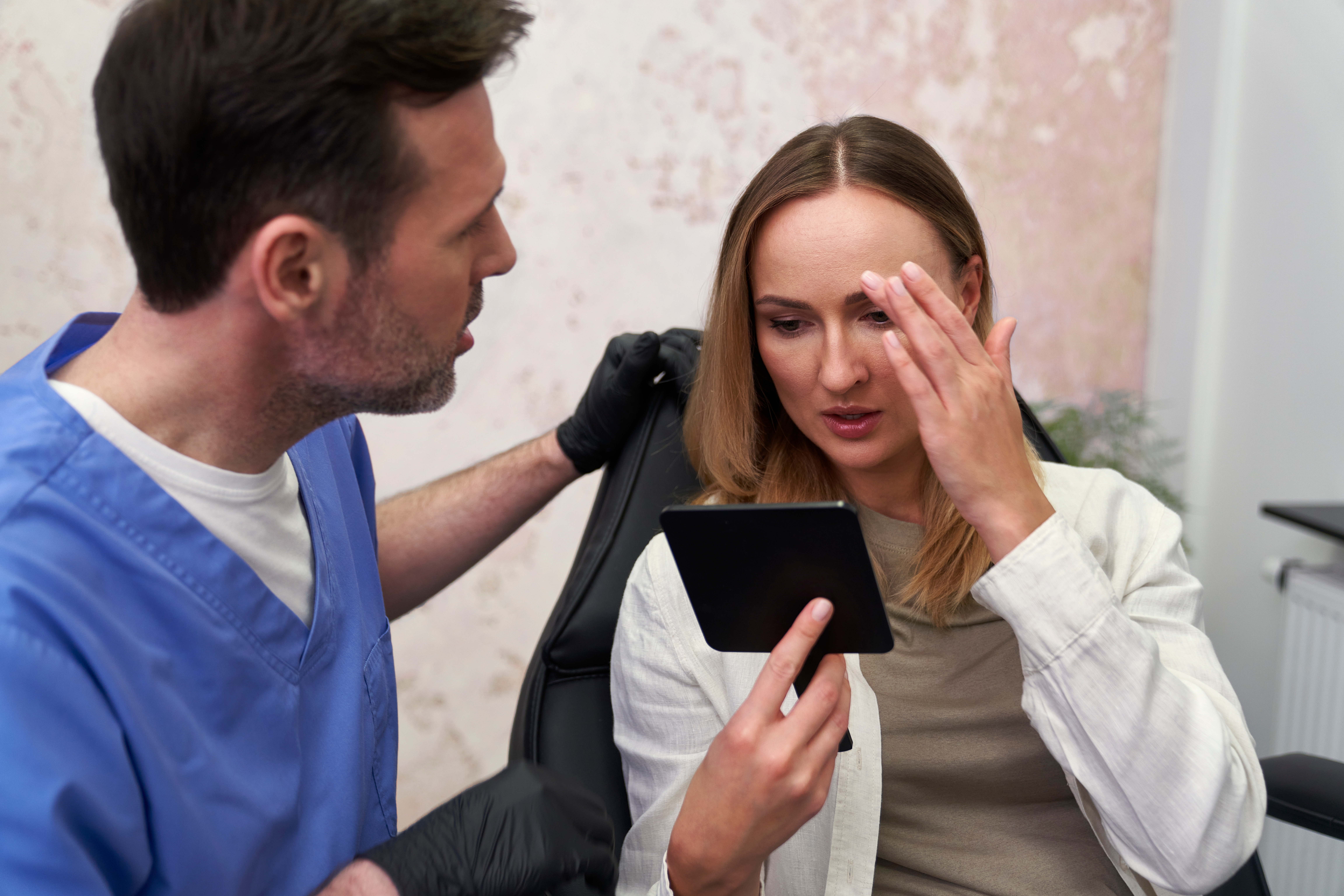 eye doctor speaking to a woman who