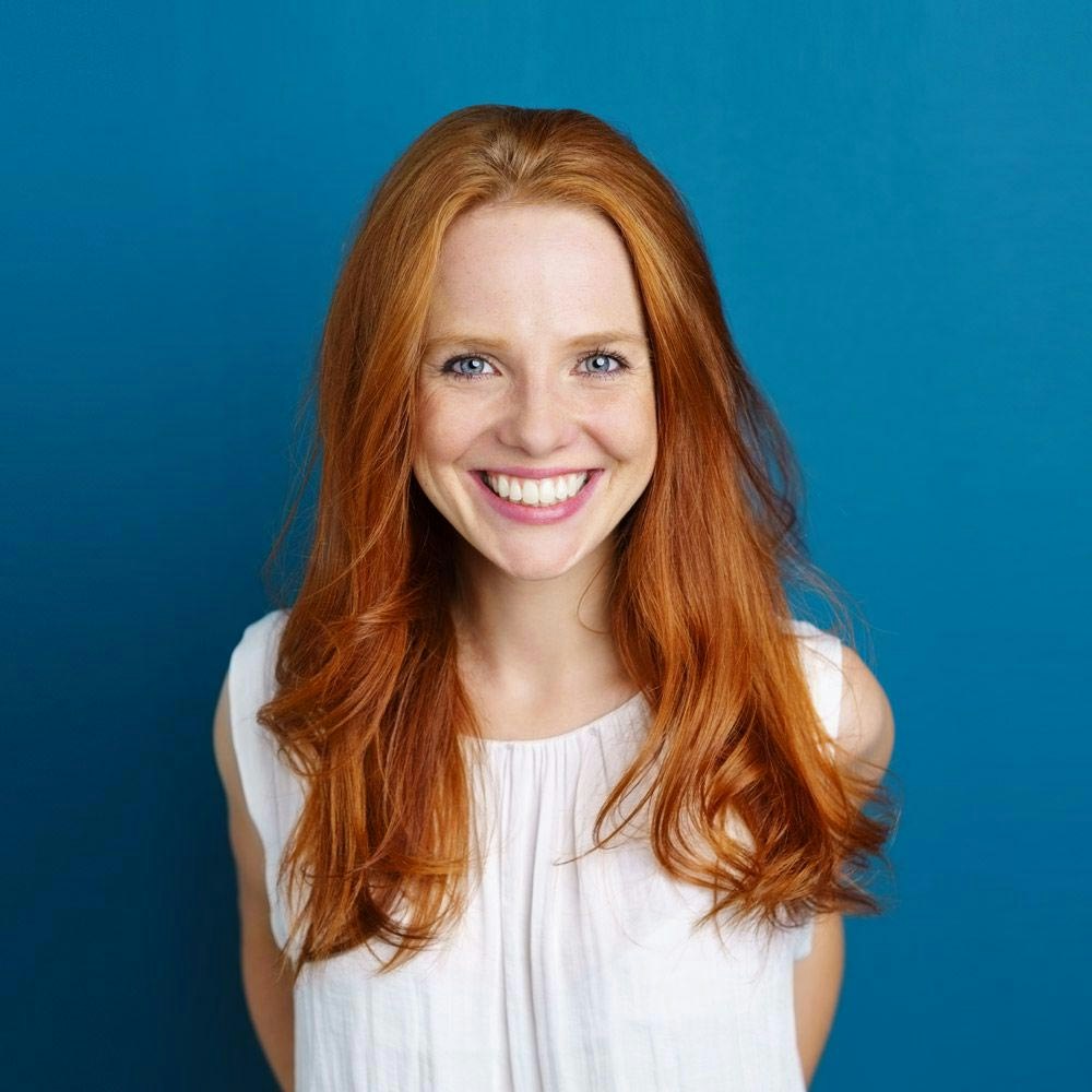 A young woman smiling confidently