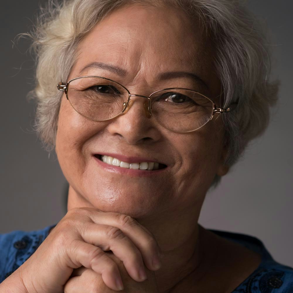 Mature woman smiling with dentures