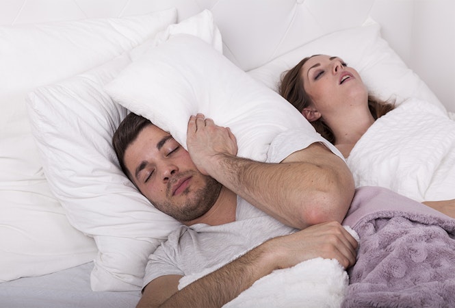 Woman who can't sleep because partner is snoring.