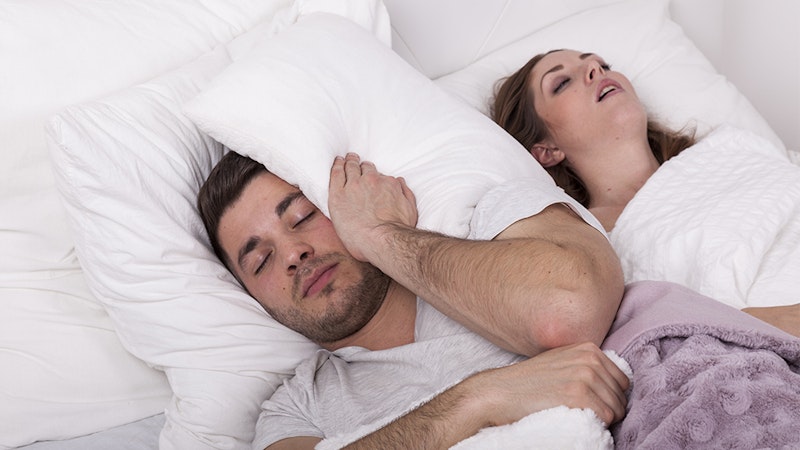 Woman who can't sleep because partner is snoring.