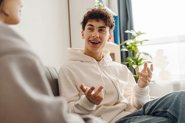 young man smiling with braces