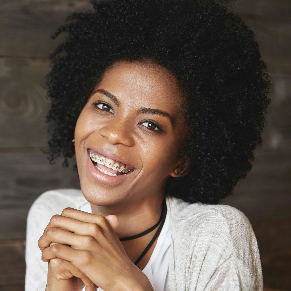 Young professional woman smiling with braces