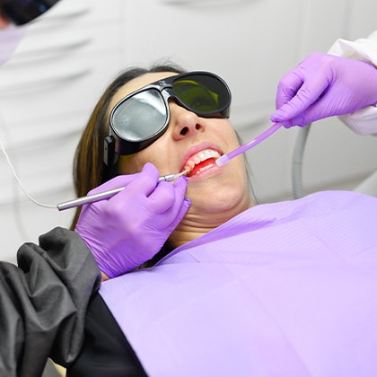 Patient receiving laser dentistry