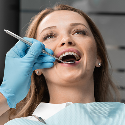 woman receiving dental exam