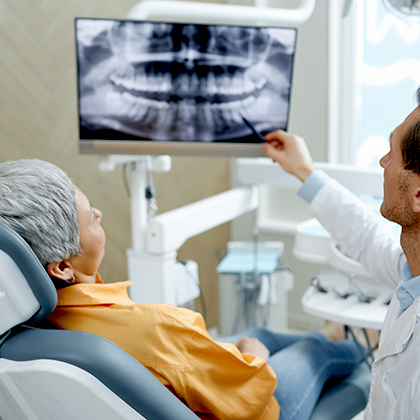 dentist reviewing scans with patient