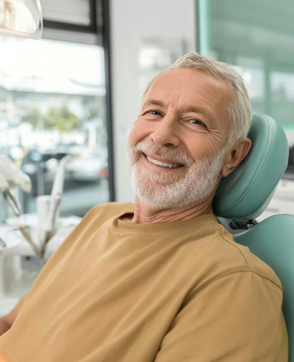 senior man smiling in the dental chair