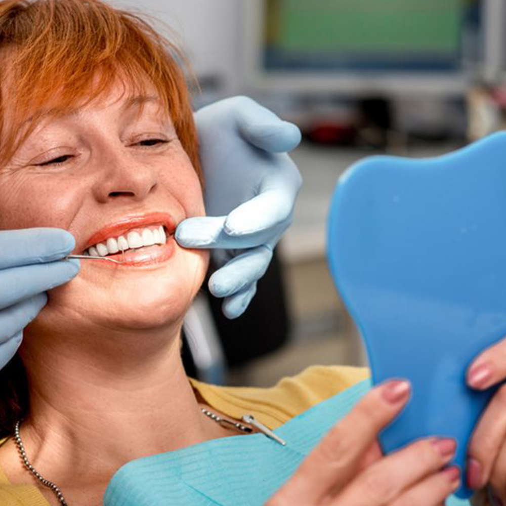 woman smiling in the dentist's chair