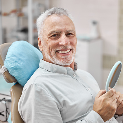man smiling in the dental chair