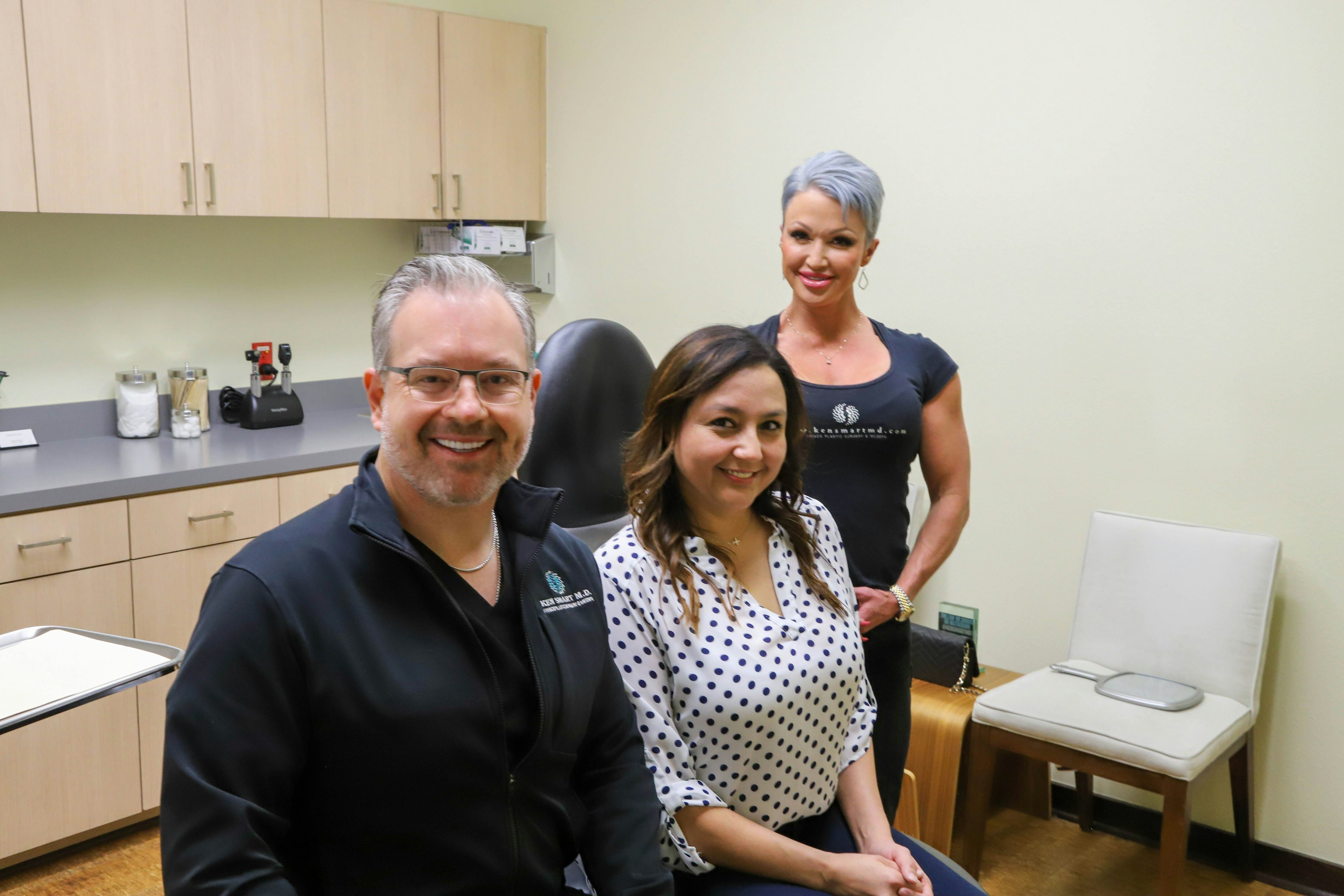 Dr. Smart, patient, and assistant smiling