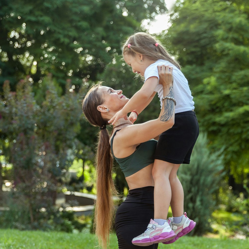 mother holding her daughter