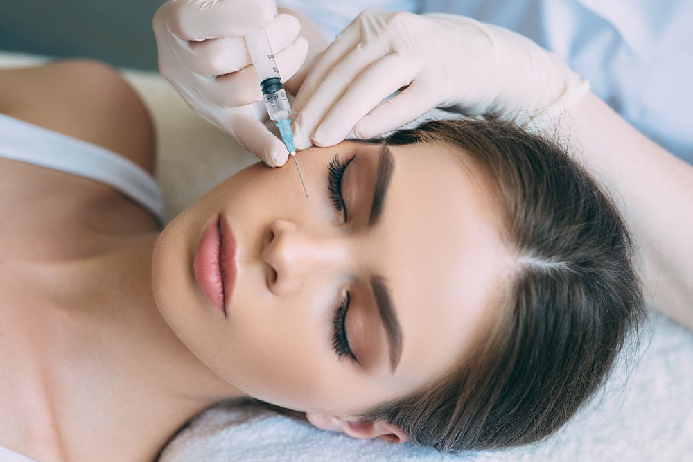 woman getting fillers injections