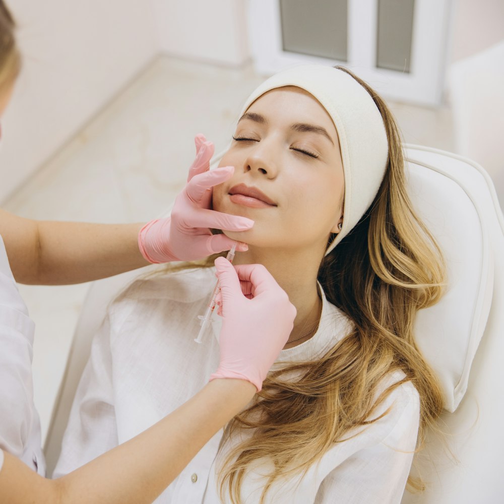 Woman receiving dermal fillers in her chin